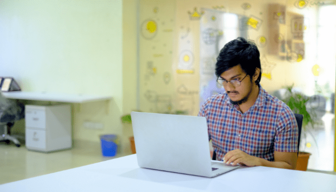 An image of a man researching the process of flipping homes.