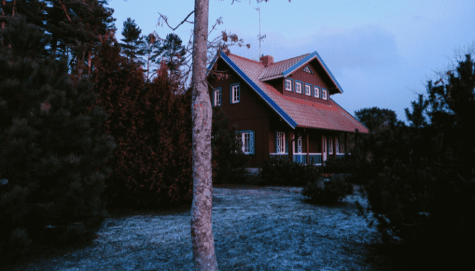 An image of a house surrounded by trees.