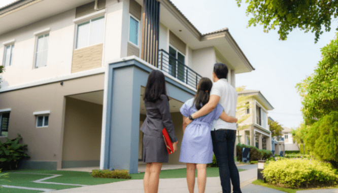 A real estate agent, who is different from a broker, showing people a house.