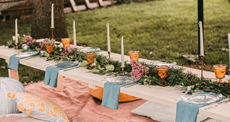 An outdoor table where you can throw a housewarming party.