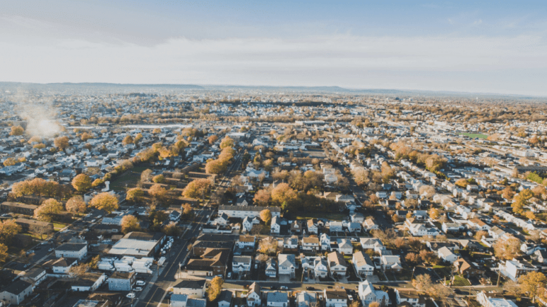 A New jersey skyline near a house for sale.