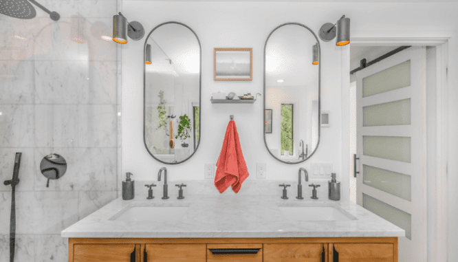 A bathroom remodel featuring a double vanity.