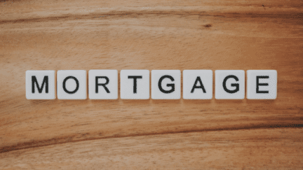 Scrabble tiles spell out the word "mortgage" as homebuyers contemplate, "how much mortgage can I afford?"