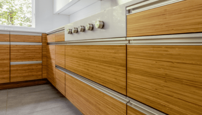 A kitchen with paneled wood cabinets that are on trend.