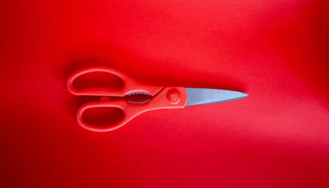 Scissors used as a tool to move into a new house.