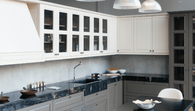 An image of a grey and white kitchen used to demonstrate what a panel-ready appliance looks like.