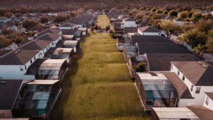 An image of houses to demonstrate what homeowners insurance covers.