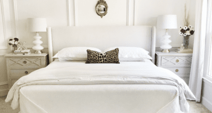 A bedroom where a bedskirt may be out of style.