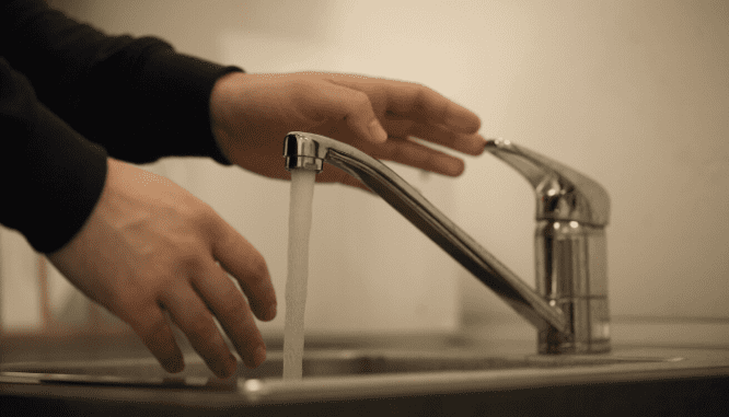 A running faucet, which is part of the utilities you might not want to shut off.