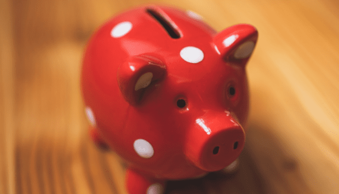 A ceramic piggy bank symbolizes investments to save for a house.