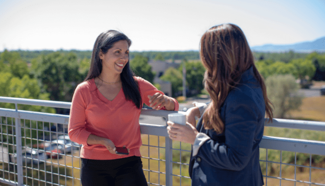 Two people talking about the signs of a good real estate agent.