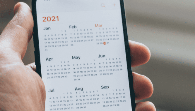 A calendar on a phone, which might help you decide when is the best day to list your house.