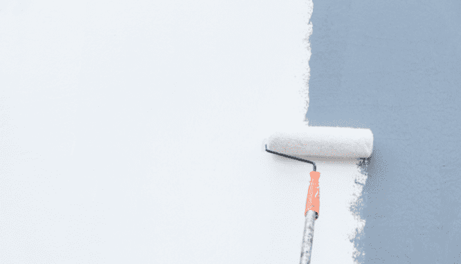 a paint roller painting over a blue wall, which you may want to do before you sell your house.