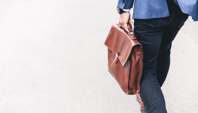 An attorney walking to a case where an hoa is enforcing their rules to a homeowner.