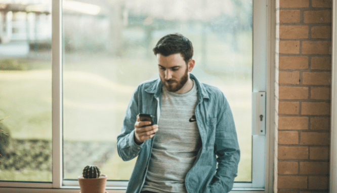 A person researching on their phone the best ways to search for a realtor.