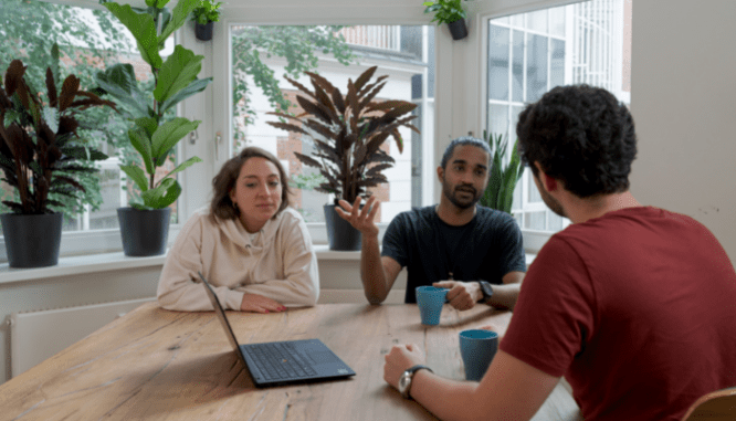 A couple discussing refinancing their mortgage with their lender.