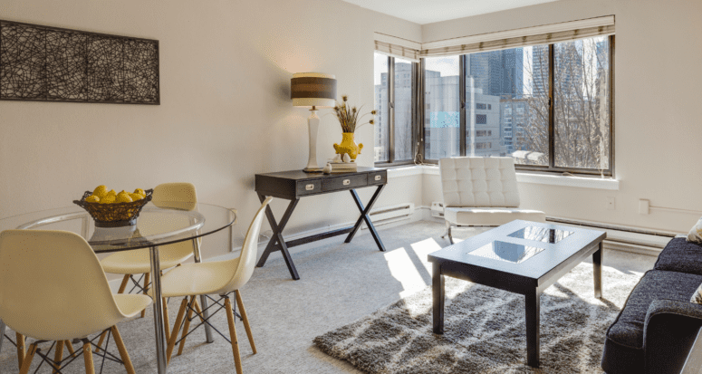 The living and dining area of a one bedroom apartment that is hard to sell.