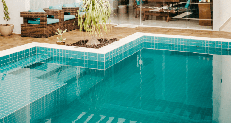 A swimming pool at a house, which may or may not increase its value.