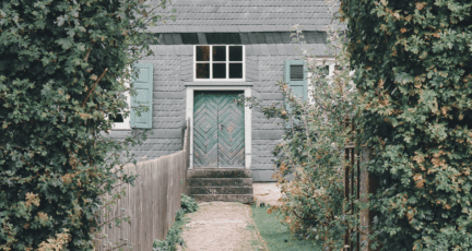 A door in front of a house.