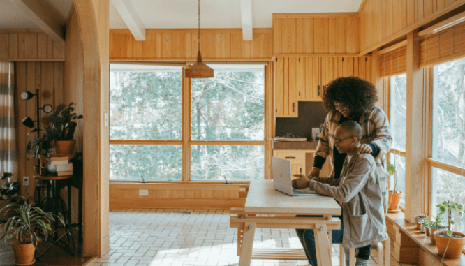 Two people researching how much house they can afford with FHA.