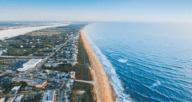 A beach in Florida near a house that has closing costs.