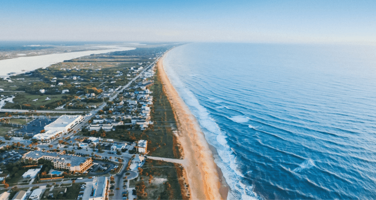 A beach in Florida near a house that has closing costs.