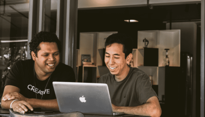 Two people researching first time home buyer programs.