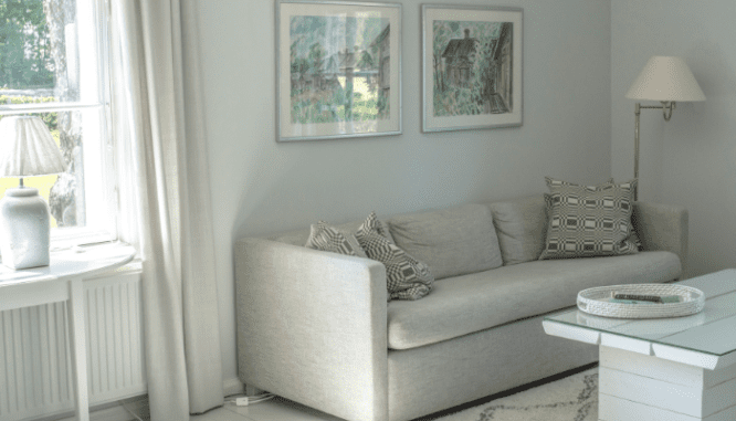 A light colored living room, which could help sell a 2 bedroom house.