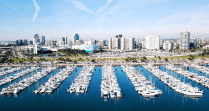 A marina in Long Beach near a house for sale.