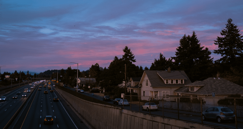 Houses near a highway, which is an undesirable location.