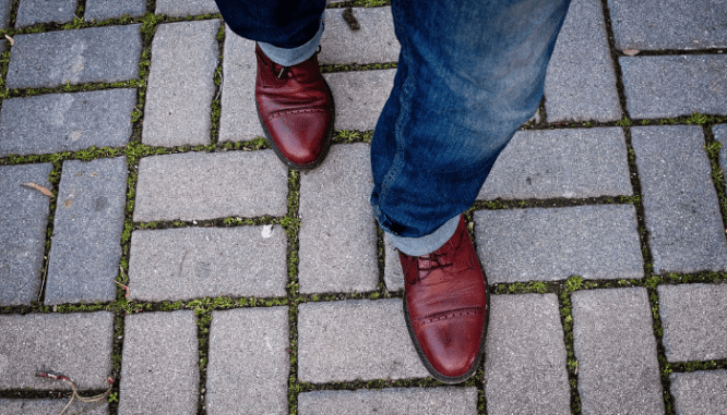 A person walking to an open house.