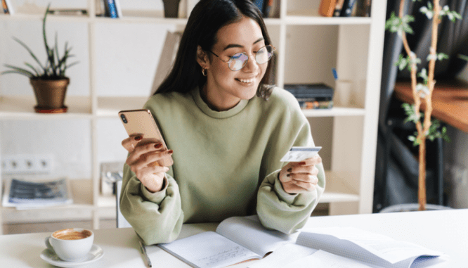 A person reviewing a credit card before getting a mortgage loan.