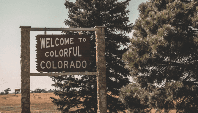 a sign that says Colorful Colorado to represent the best neighborhoods in Denver