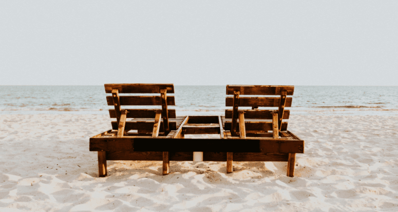 A beach chair near a real estate investment.