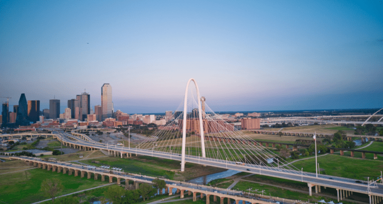 A skyline of Dallas near a real estate company.