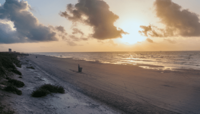 A beach in Texas near a real estate company.