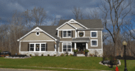 brown and gray house on a hill showing how much money you could keep after selling a house