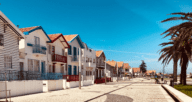 A street of houses along the sea where homeowners wonder if we are in a recession in 2022.