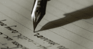 A pen writing on paper, such as when writing a letter to a seller when buying a home.