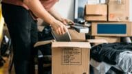 A man packing while relocating for work.