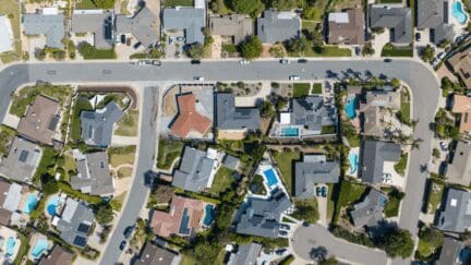 Aerial view of houses in California where there are taxes when selling a house.