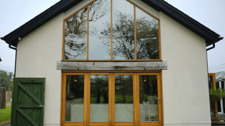 A large front window in a living room, something buyers may want in a home.