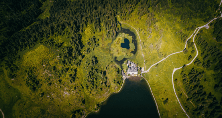 Aerial view of home on over 8 acres of land.