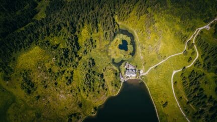 Aerial view of home on over 8 acres of land.