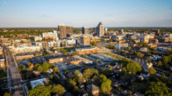 Aerial view of Greensboro, where home owners may be interested in utilizing the services of a we buy houses for cash company