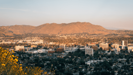 Aerial view of a neighborhood in Riverside CA where homeowners may be interested in the services of a house buying company