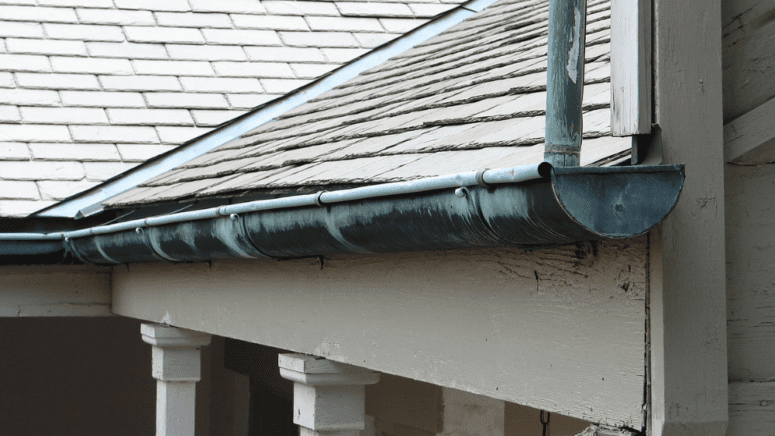 A home with gutters in need of repair.