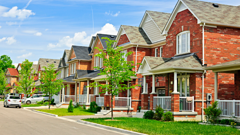 An image showing a row of houses in a neighborhood.