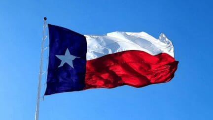 A Texas state flag that represents how to sell a house by owner.