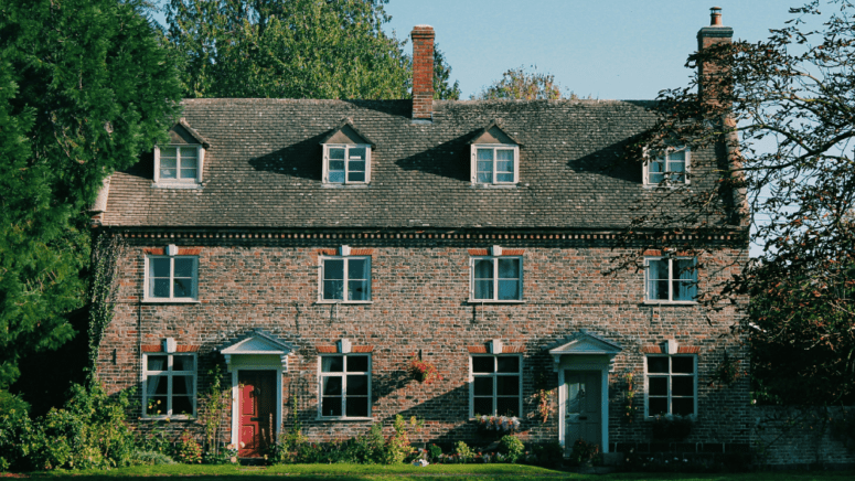 An image of a house listed on foreclosure websites, where buyers and investors can find properties priced below market value.